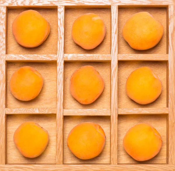 Shadow box with apricots — Stock Photo, Image
