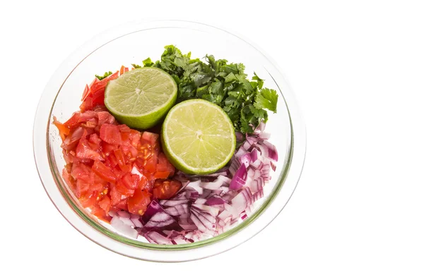 Ingredients for fresh salsa in clear bowl — Stock Photo, Image