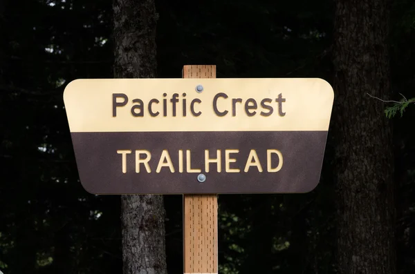 Stock image Pacific Crest Trail sign on post with dark background