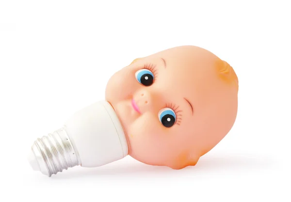 Lâmpada com cabeça de brinquedo bebê — Fotografia de Stock