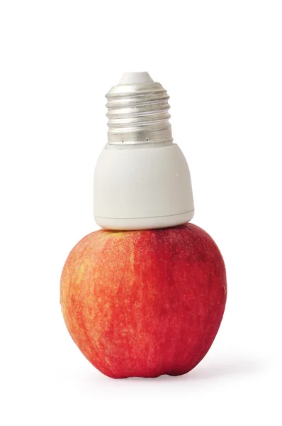 Лампа с красным яблоком — стоковое фото