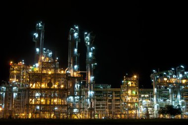 Night scene of chemical plant clipart