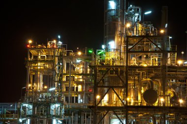 Night scene of chemical plant clipart