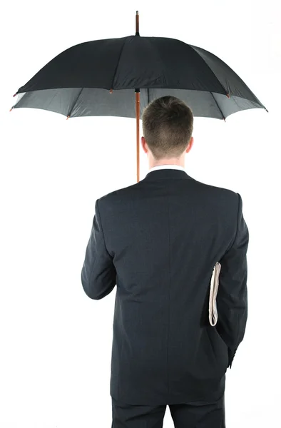 Homme d'affaires avec un parapluie et un journal — Photo