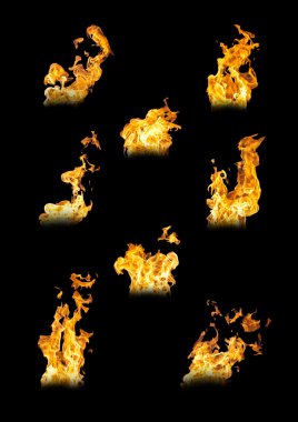 Tongues of fire on black background clipart