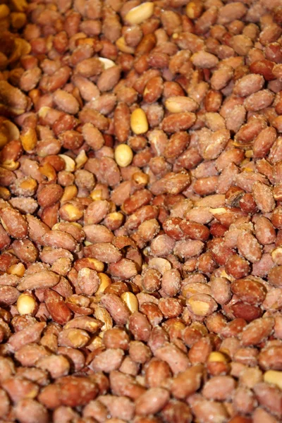 stock image Salty peanuts background - vertical