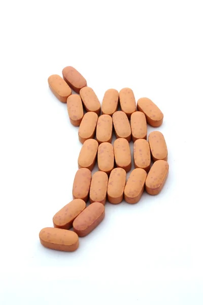 Oranje pillen in maag vorm — Stockfoto