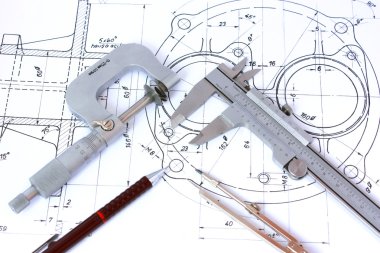 Micrometer, Caliper, Mechanical Pencil and Compass on Blueprint clipart