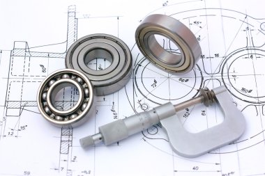 Ball bearings with micrometer on technical drawing clipart