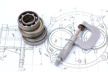 Three ball bearings over and over with micrometer on technical d clipart