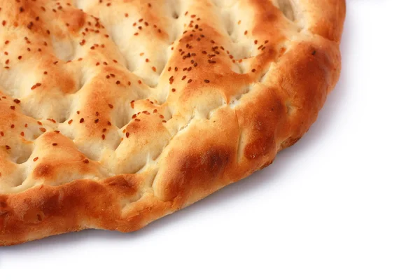 Pita Bread isolated on white with diagonal half copyspace. Popular food in Ramadan in Turkey. — Stock Photo, Image