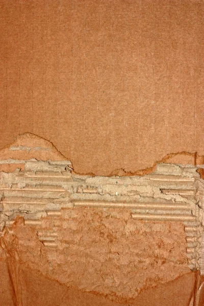 Порванный картонный фон — стоковое фото