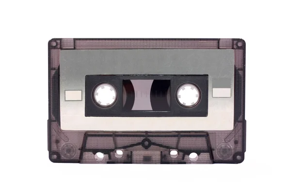 白で隔離される灰色透明コンパクト カセット — ストック写真