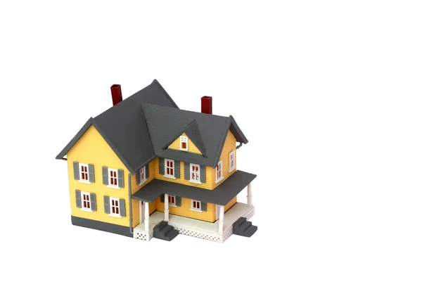 Beyaz arka plan ile boşaltmak izole minyatür ev — Stok fotoğraf