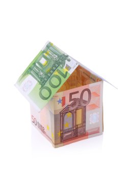 House built with Euro money bills isolated on white background clipart