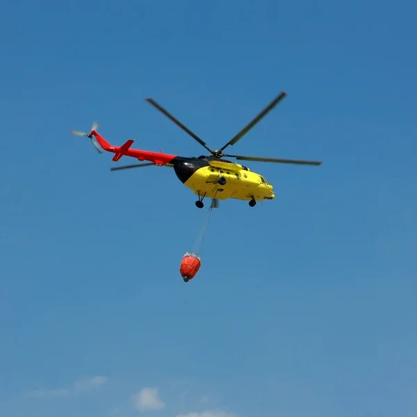 stock image Fire rescue helicopter with water bucket - Square crop