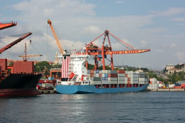 Large container ship in a dock at port clipart