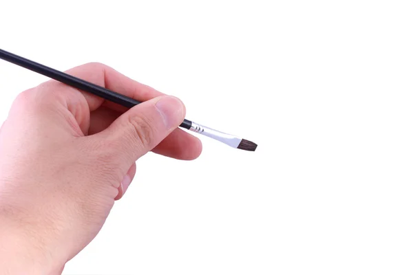 Hand holding artist brush isolated — Stock Photo, Image