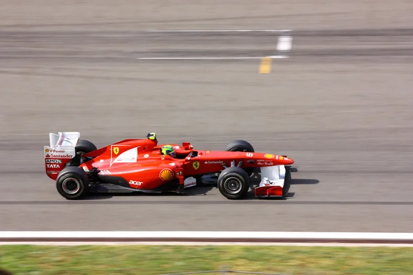 Ferrari на гонку з Массі Felipe — стокове фото