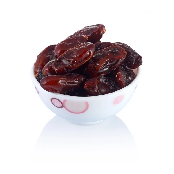A dish of dates isolated on white background — Stock Photo, Image