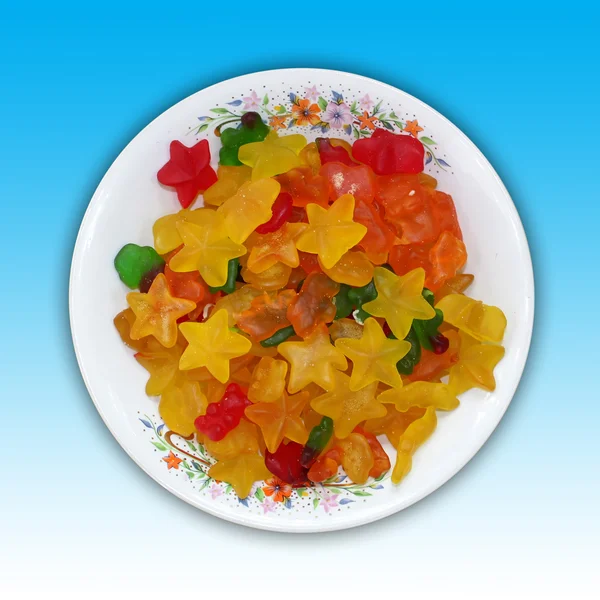 Egy tányér, csillag és a medve alakú zselés cukorka — Stock Fotó