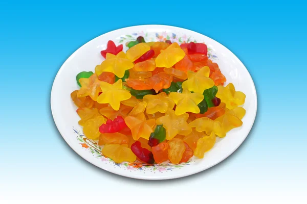 Egy tányér, csillag és a medve alakú zselés cukorka — Stock Fotó