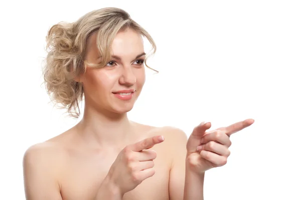 A woman is pointing to something — Stock Photo, Image