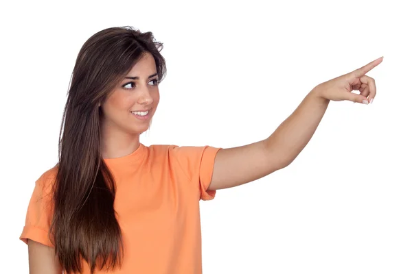 Menina atraente com cabelos longos indicando algo à mão — Fotografia de Stock