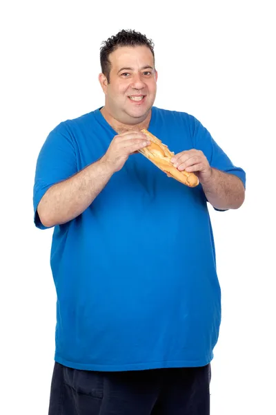 Homem gordo feliz com um pão grande — Fotografia de Stock