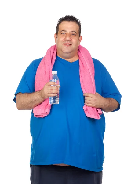 Hombre gordo en el gimnasio con una botella de agua — Stockfoto