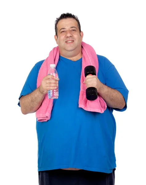 Fat man in the gym with a water bottle — Stock Photo, Image