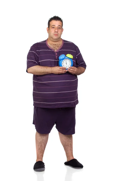 Fat man with a blue alarm clock — Stock Photo, Image