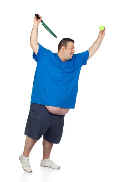 Fat man with a racket playing tennis — Stock Photo, Image