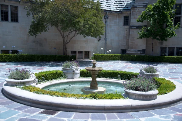 Stone house with beautiful sunny garden Stock Photo