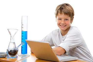 Young student with laboratory equipment. clipart