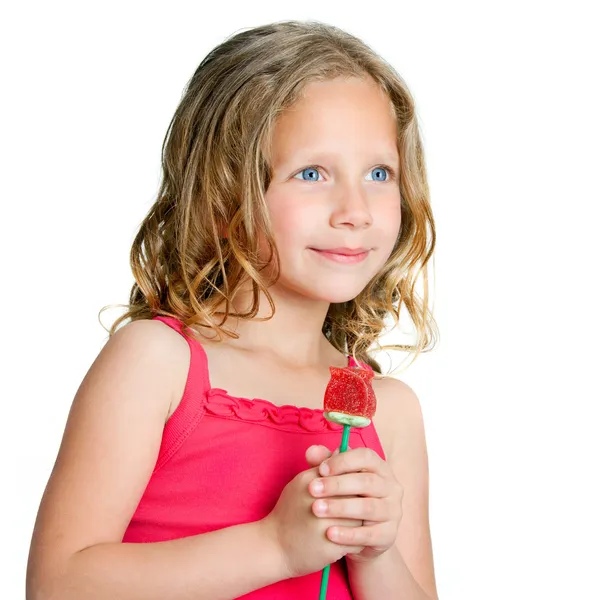 Bliska portret słodkie dziewczyny z cukierek róża. — Zdjęcie stockowe