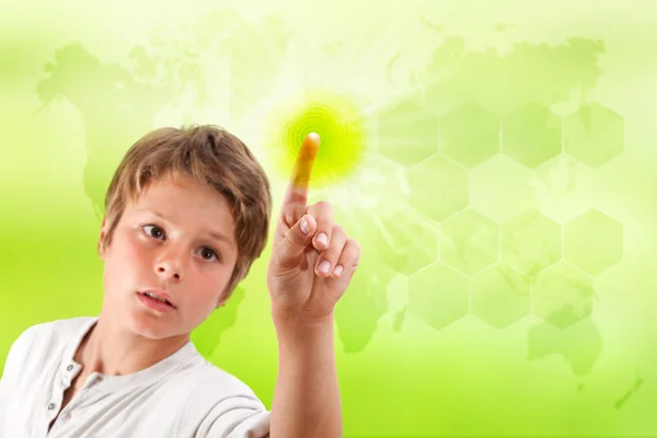 Chłopiec dotykając futurystyczny interfejs zielony. — Zdjęcie stockowe
