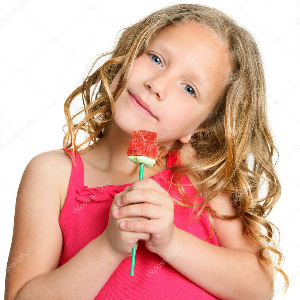 Close up of cute girl holding candy rose.