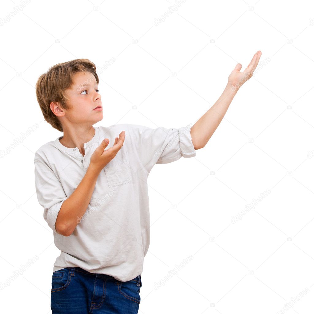 Young Boy pointing with hands at copy space.