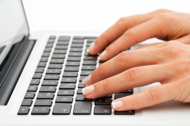 Extreme close up of hands on keyboard. clipart