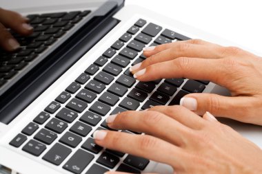 Macro close up of female hands on keyboard. clipart