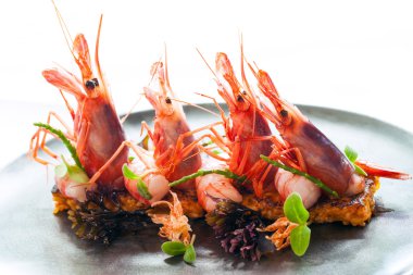 King prawns with crisp seafood rice. clipart