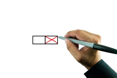 Businessman hand marking x on the check box clipart