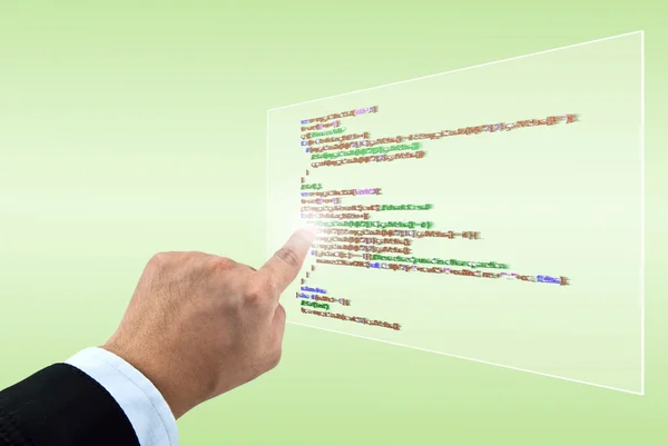Бізнес рука вказує сценарій програмування у віртуальному екрані — стокове фото