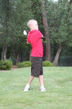 Young determined male golfer. clipart