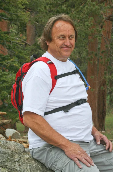 Happy resting male baby-boomer hiker — Stock Photo, Image