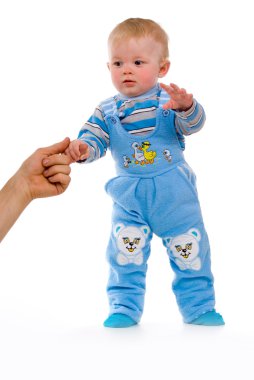 A small child takes its first steps clipart