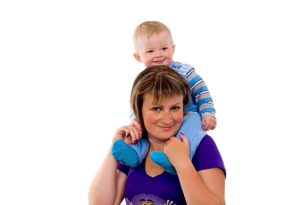 A small child sitting on the neck of the mother — Stock Photo, Image