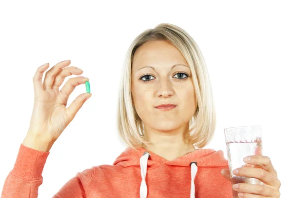 Beautiful girl with medication and water — Stock Photo, Image