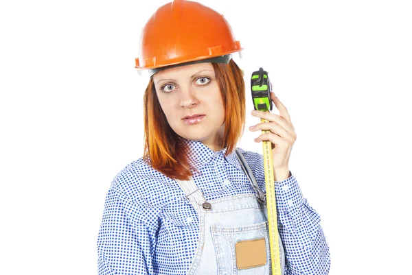 Builder with a tape measure and helmet — Stock Photo, Image